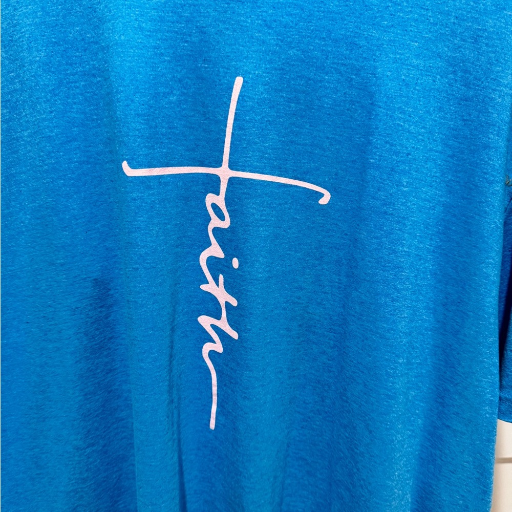 Women’s turquoise/blue as tee shirt XL. has Faith in pink on the front. NWOT